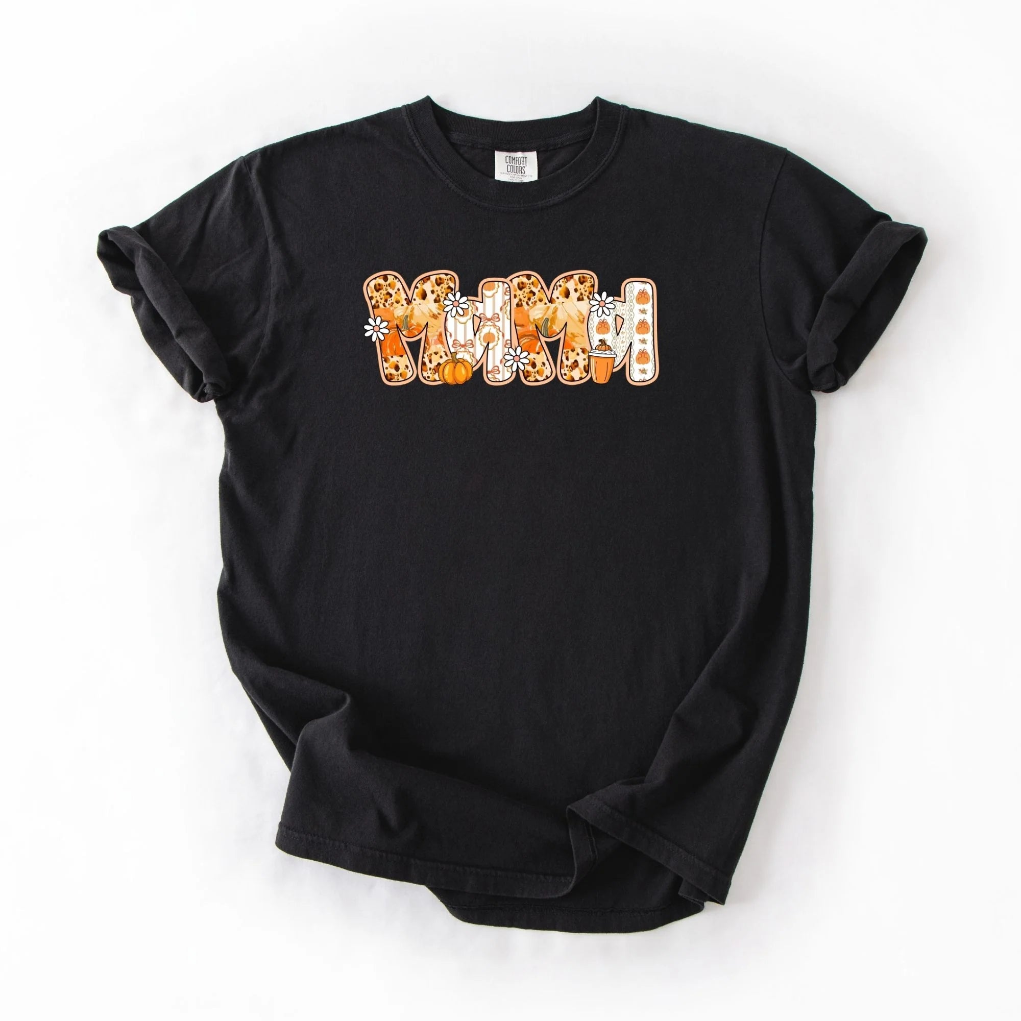 Black Comfort Colors tee with MAMA spelled out in fall patterned letters featuring leopard print, gnomes, pumpkins, daisies and PSL coffee cup