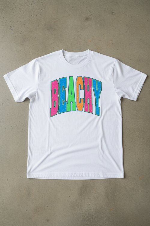 Beachy neon collegiate graphic on white t-shirt flat lay