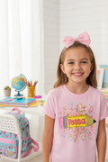 Young girl wearing personalized pink pencil glitter back to school graphic tee with graphic on the front