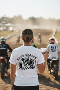 Woman wearing Moto Season Moto Mom tee showing full back print at motocross event