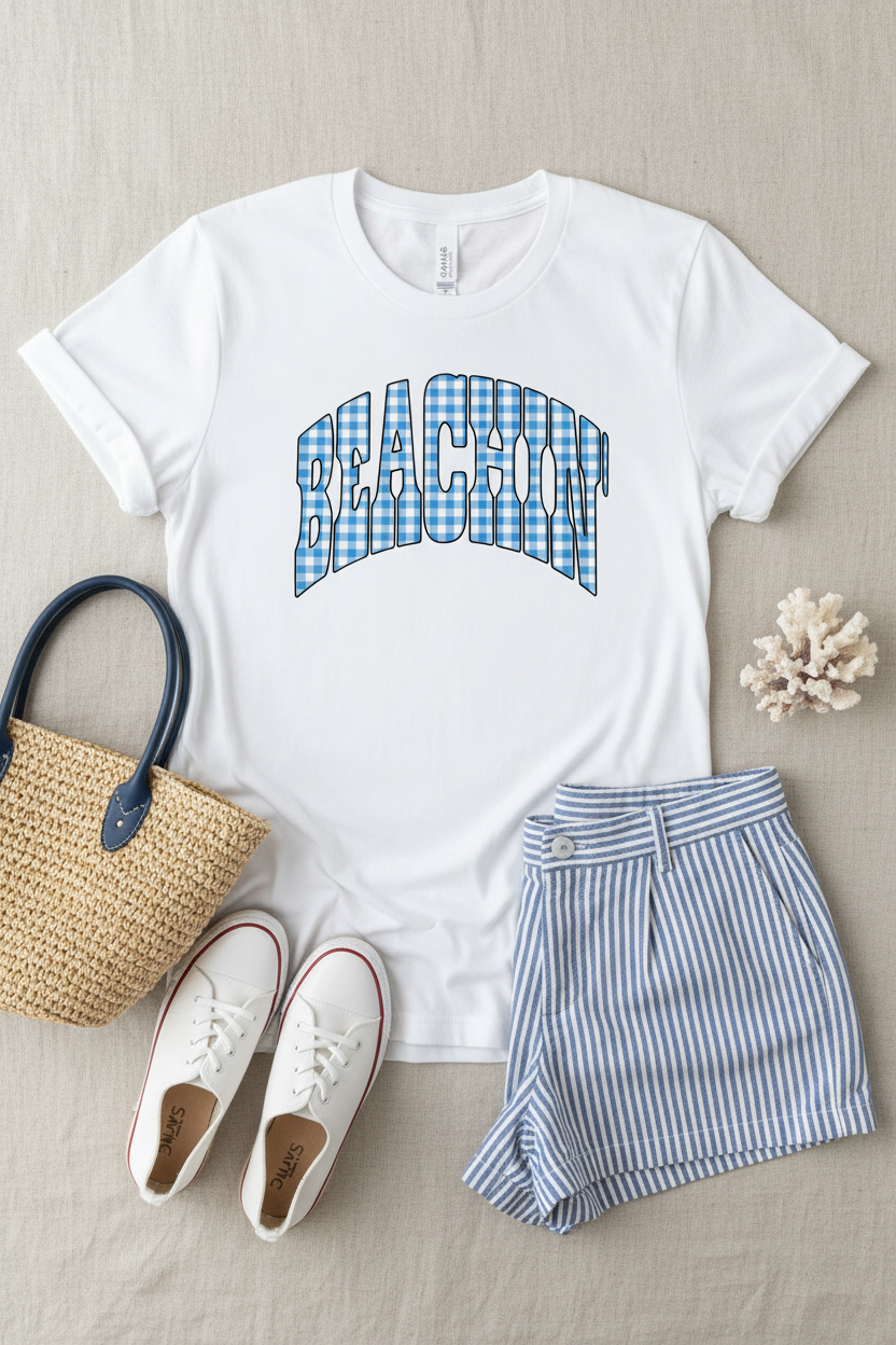 Beachin' gingham collegiate graphic on white t-shirt flat lay