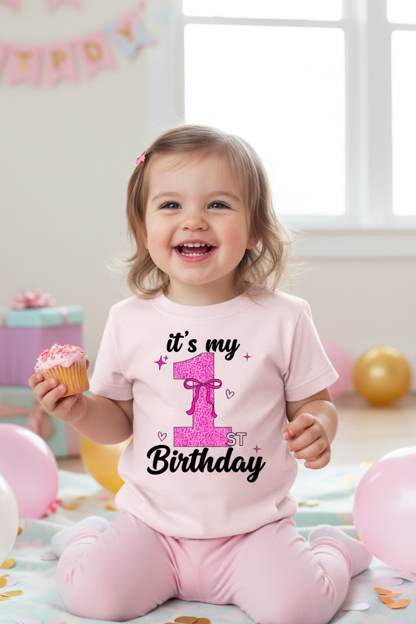 Young girl wearing It's My 1st Birthday leopard bow light pink tee at birthday party