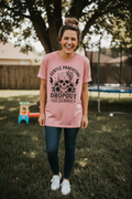 Woman wearing Gentle Parenting Dropout T-Shirt in dusty rose in a fun casual lifestyle photo