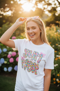 Woman wearing Summer floral bubble letter tee outdoors on sunny day