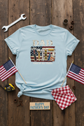 Dad Fixer of All Things T-Shirt styled with wrench, measuring tape, and American flag on rustic wood