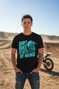 Person wearing Dirt Bike State of Mind black tee at outdoor motocross track