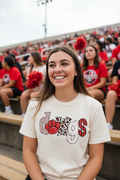 Woman at football game wearing ivory Bulldogs paw print spirit tee